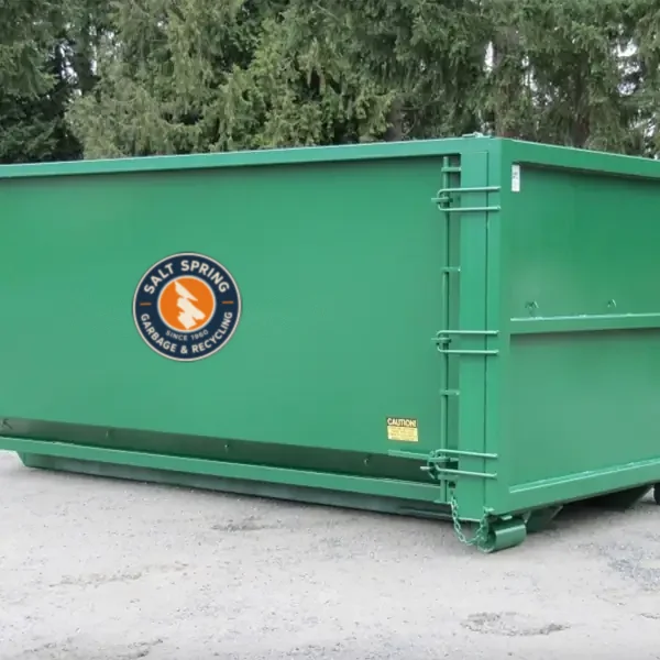 Green roll-off rental bin with the Salt Spring Garbage logo