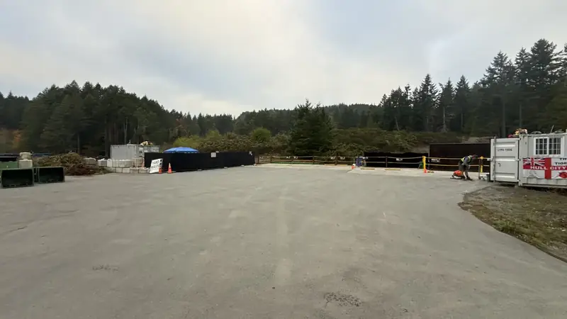 Wide view of the drop-off deck and transfer station yard at 360 Blackburn Rd, Salt Spring Island